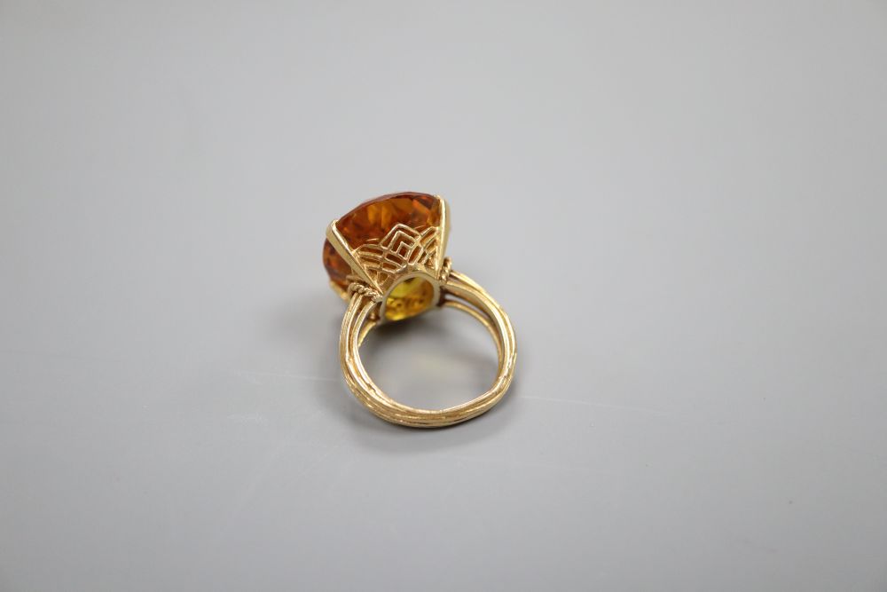 A citrine dress ring, tests as 18ct gold, 12.2g gross